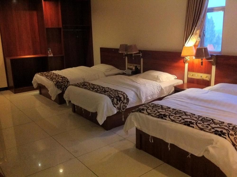 Guoxing Business Hotel Чжаоцин Екстериор снимка